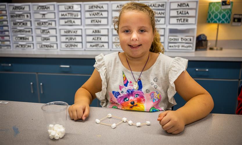 Students make constellations out of marshmallows and toothpicks